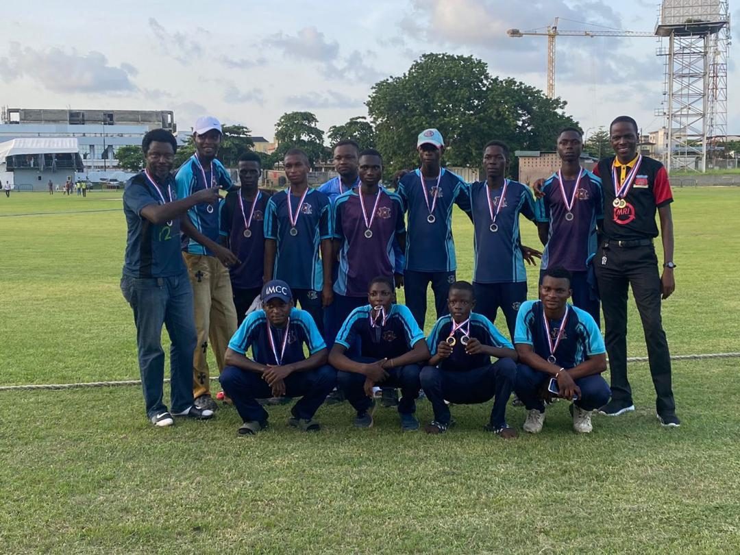The IMCC team posing with medals around their necks after a tournament